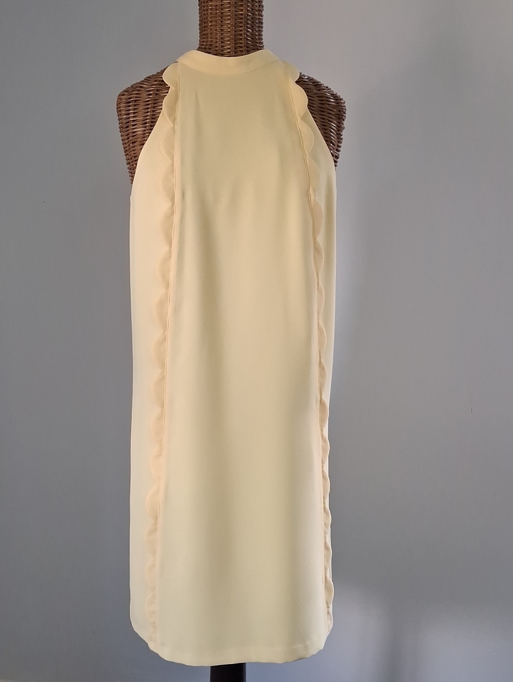 CeCe Sleeveless Scalloped Mini Dress in Pale Yellow